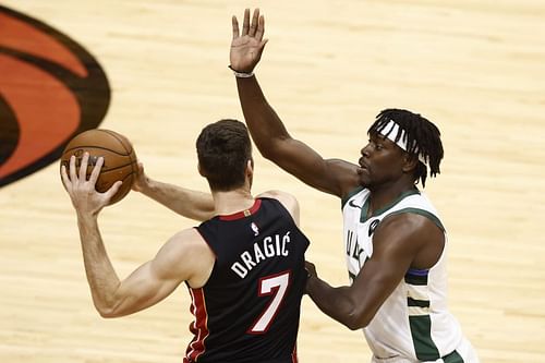 Jrue Holiday of the Milwaukee Bucks guards Goran Dragic of the Miami Heat - Game Three