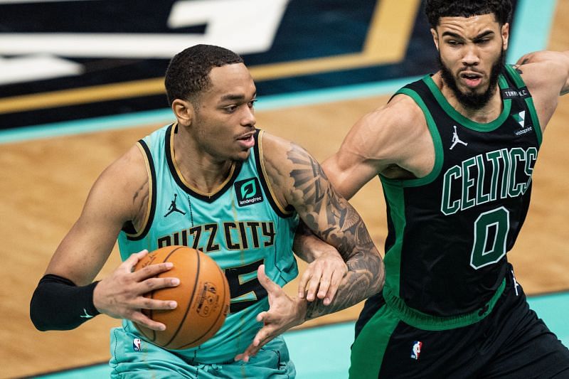 PJ Washington (#25) of the Charlotte Hornets (left) in action