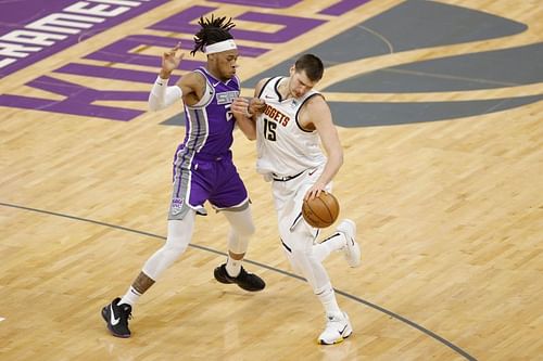 Sacramento Kings center Richaun Holmes duels Nikola Jokic of the Denver Nuggets