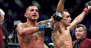 Watch: Jon Anik shows fans the blood-stained shirt he wore during Tony Ferguson's classic win over Anthony Pettis
