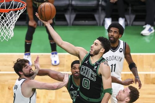 Jayson Tatum finishes at the rim