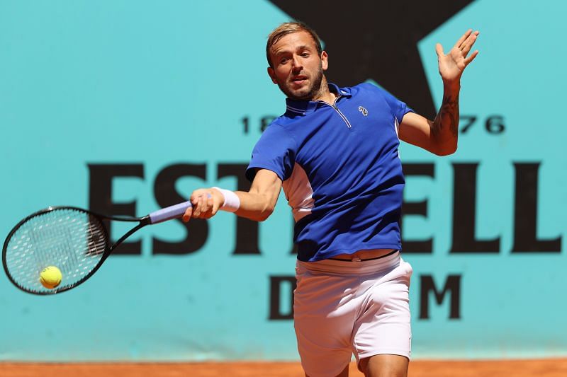 Dan Evans hits a forehand