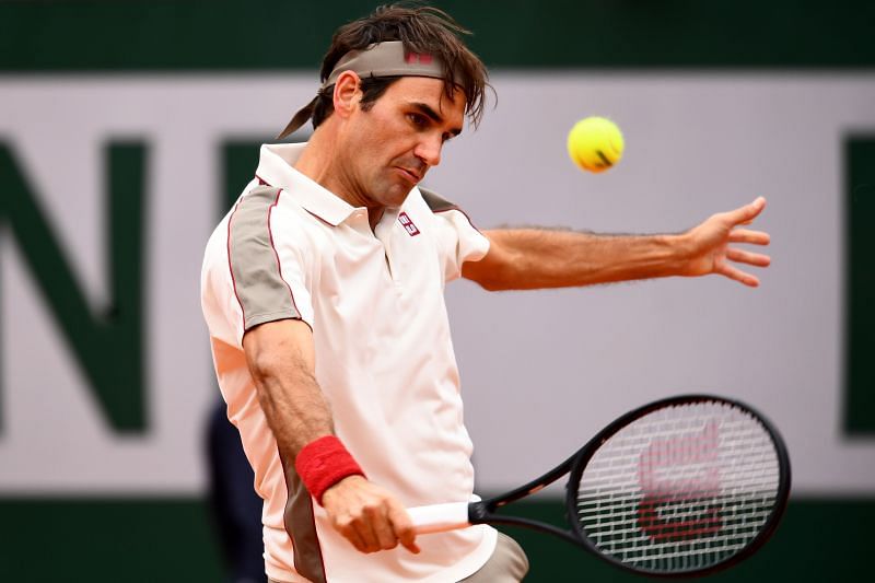 Roger Federer slices a ball at Roland Garros 2019
