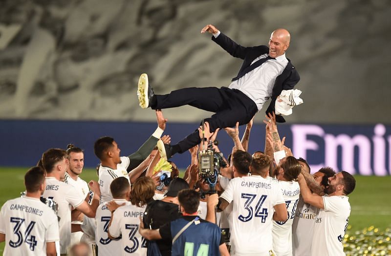Real Madrid manager Zinedine Zidane is thrown up in the air by his players after Madrid secure the La Liga title in the 2019-20 season