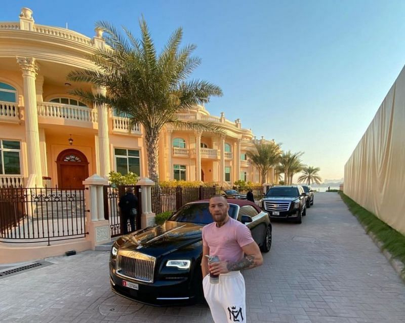 McGregor flaunts his mansion and a line of Rolls Royce cars.