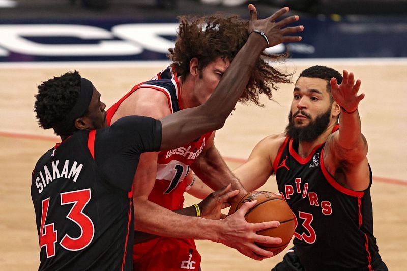 Robin Lopez #15 is fouled by Pascal Siakam #43.