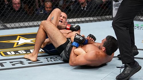 Beneil Dariush holds Tony Ferguson in a heel hook at UFC 262