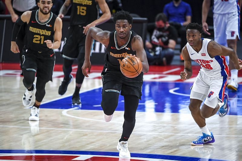 Jaren Jackson Jr. #13 dribbles the ball on a fastbreak..