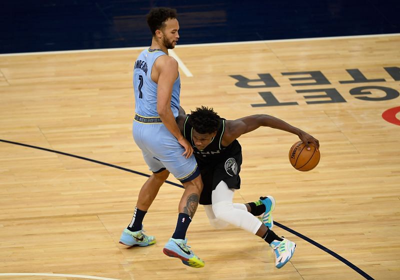 Kyle Anderson (#1) defends against Anthony Edwards (#1).