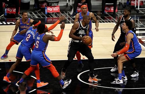 Serge Ibaka #9 of the Los Angeles Clippers handles the ball against the Oklahoma City Thunder.