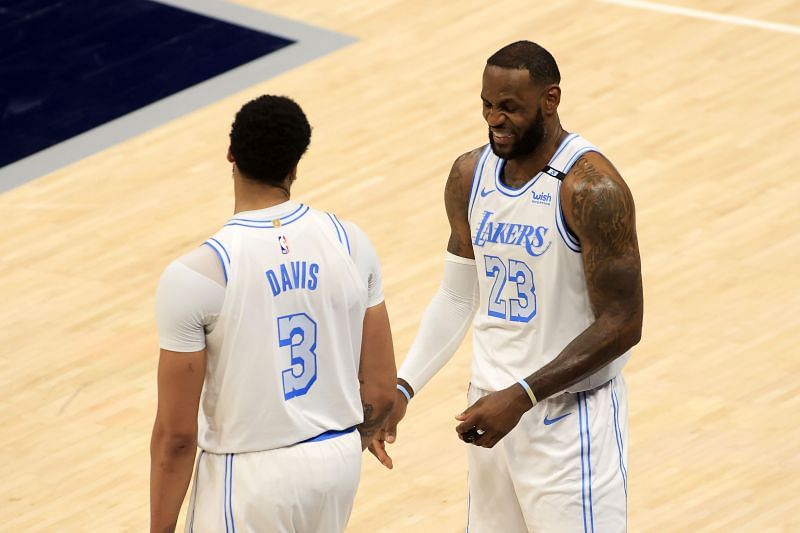 LeBron James #23 of the LA Lakers talks with Anthony Davis.