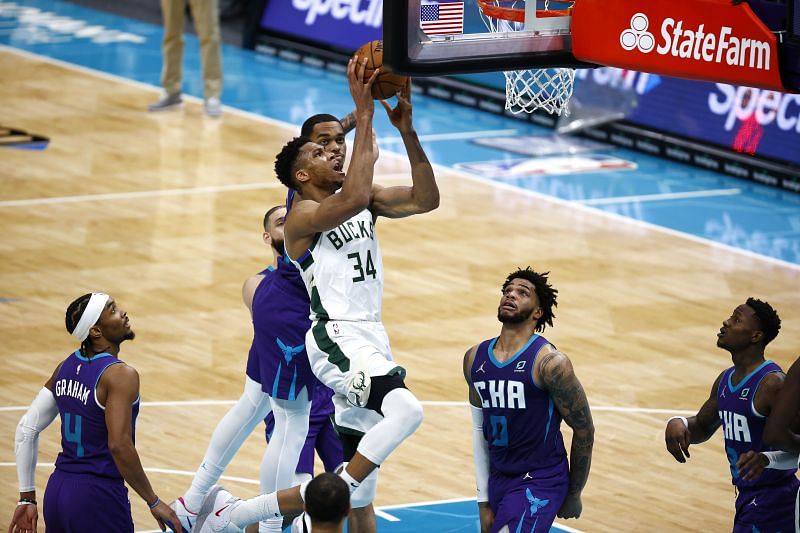 Giannis Antetokounmpo #34 drives to the basket during the third quarter of their game