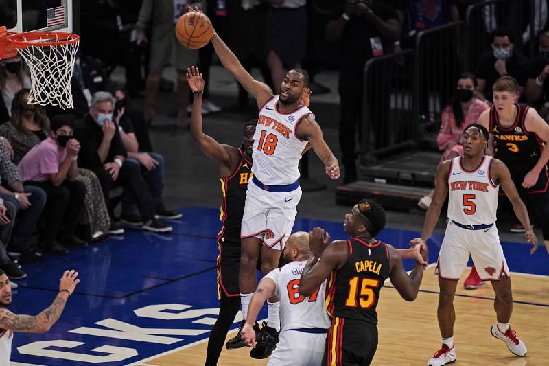 New York Knicks star Alec Burks (18) grabs a rebound during the first half of Game 1