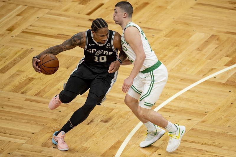 DeMar DeRozan #10 drives to the basket while guarded by Payton Pritchard #11.