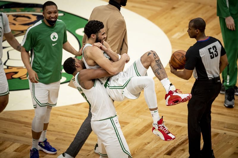 Boston Celtics celebrate after their comeback win against the San Antonio Spurs