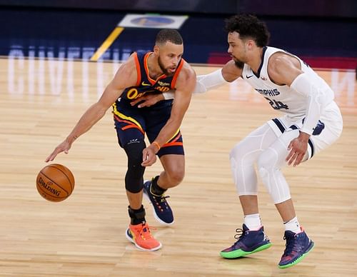 Stephen Curry is defended by Dillon Brooks