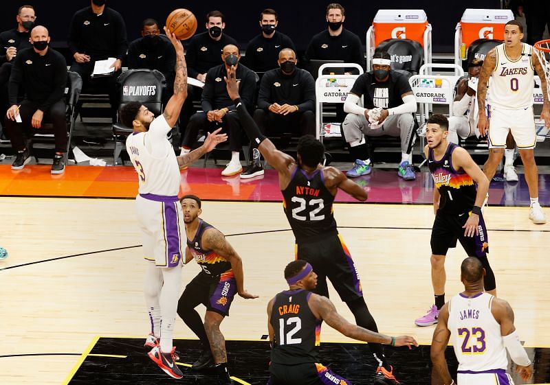 Anthony Davis #3 of the LA Lakers attempts a shot over Deandre Ayton #22 of the Phoenix Suns