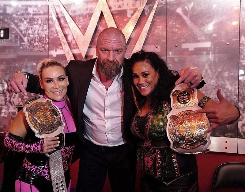 Tamina and Natalya with Triple H after their win on SmackDown
