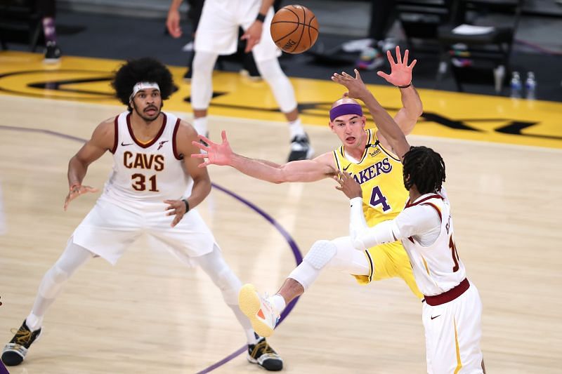 Alex Caruso #4 defends against a pass from Darius Garland #10 intended for Jarrett Allen #31.