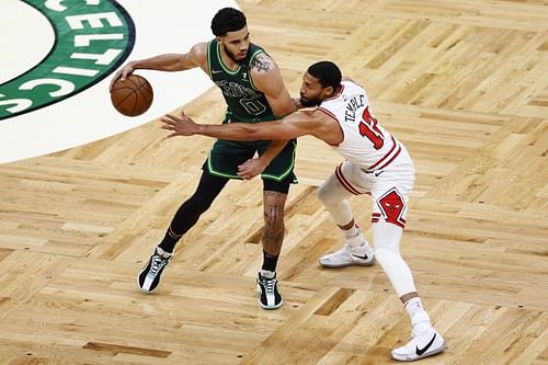 Garrett Temple #17 of the Chicago Bulls defends Jayson Tatum #0 of the Boston Celtics.