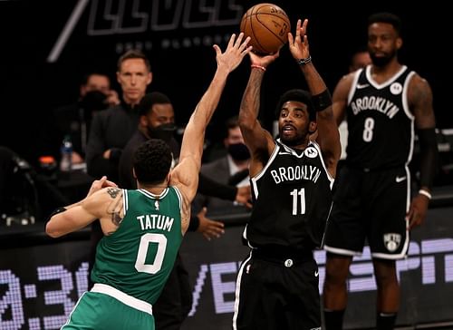 Kyrie Irving shoots over Jayson Tatum