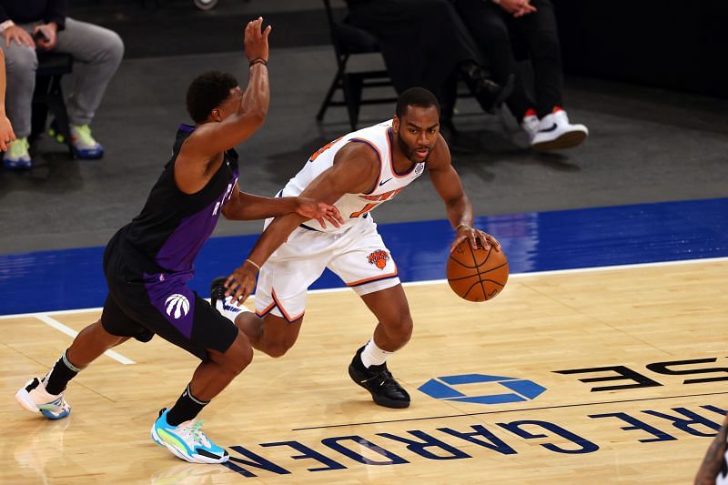 Alec Burks #18 in action against Kyle Lowry #7.