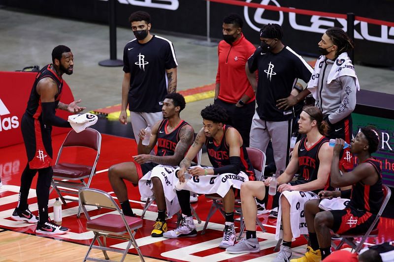 John Wall #1 speaks to his team's bench