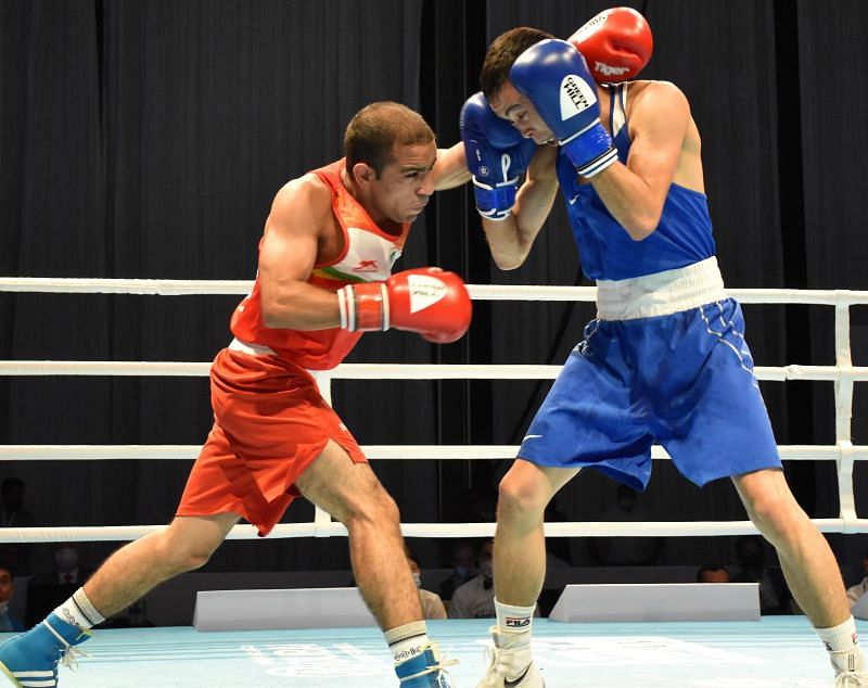 Amit Panghal (52 kg) in action during his semifinal bout at the Asian Boxing Championships in Dubai on Friday.