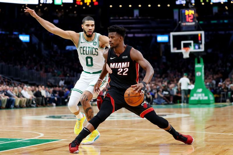 Jayson Tatum (#0) of the Boston Celtics defends Jimmy Butler (#22) of the Miami Heat.