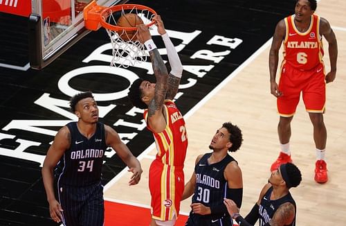 John Collins finishes a dunk