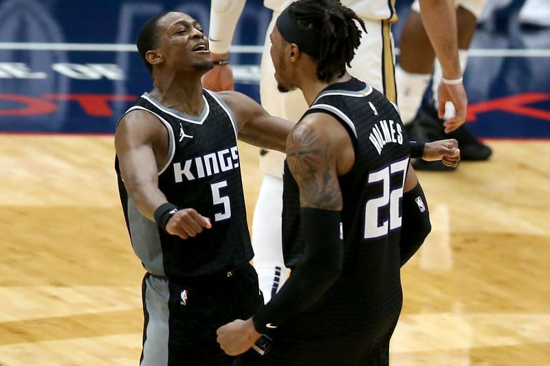 De'Aaron Fox #5 and Richaun Holmes #22 react after a basket.