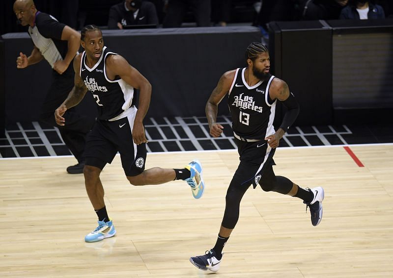 Paul George #13 and Kawhi Leonard #2 of the LA Clippers run back on defense