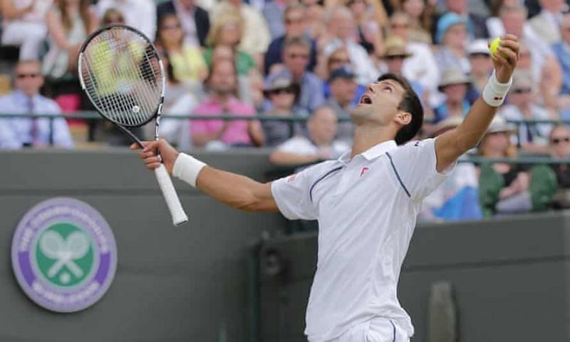Novak Djokovic reacts after surviving a tough five-set tussle against Kevin Anderson at 2015 Wimbledon.