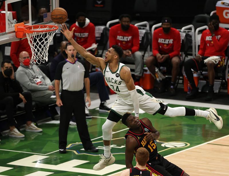 Giannis Antetokounmpo dunks the ball over Clint Capela during Game 2.