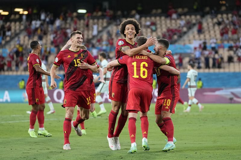 Thorgan Hazard (#16) celebrates with Axel Witsel, (centre), Thomas Meunier (left) and Eden Hazard (right) after scoring against Portugal