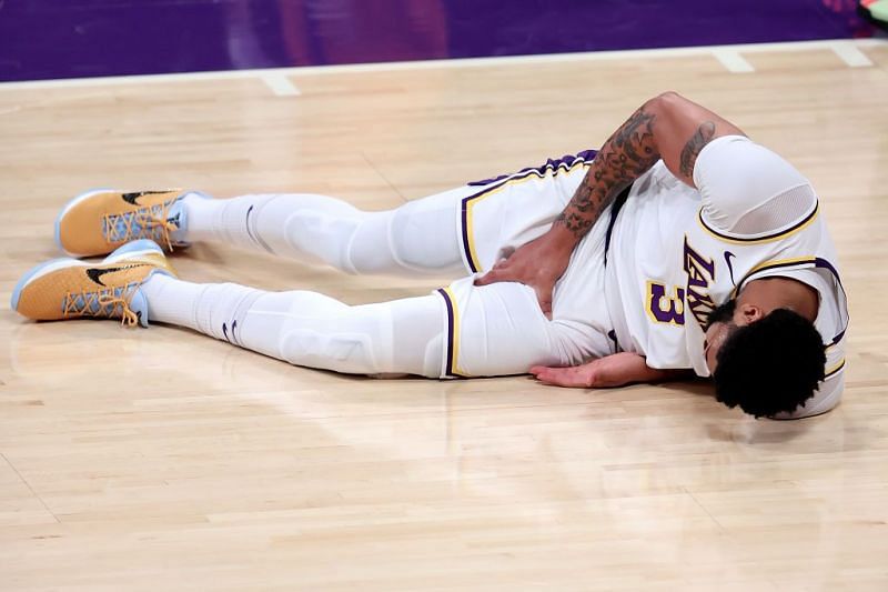 Anthony Davis winces after suffering a groin injury in Game 4