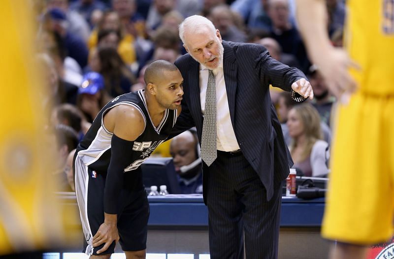 San Antonio Spurs coach Gregg Popovich with Patty Mills