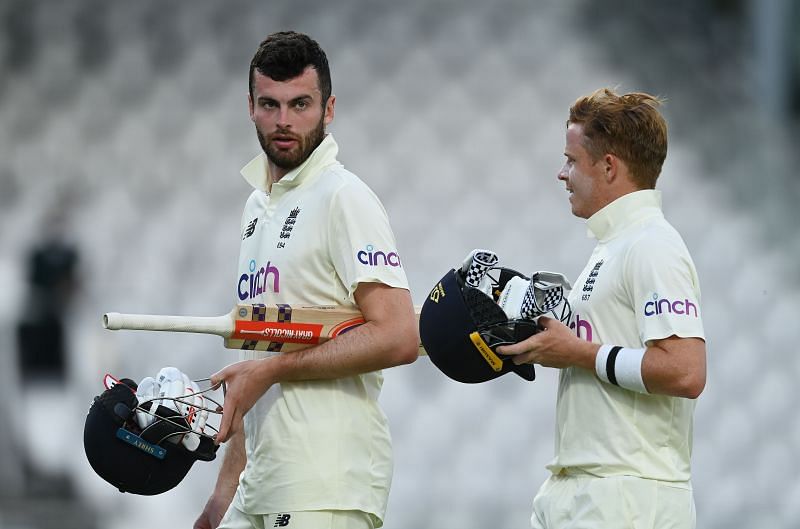 Dom Sibley (L) and Ollie Pope walk back after drawing the Test