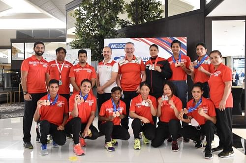 The Indian female boxers alongside other staff pose with their Asian Boxing Championships medals