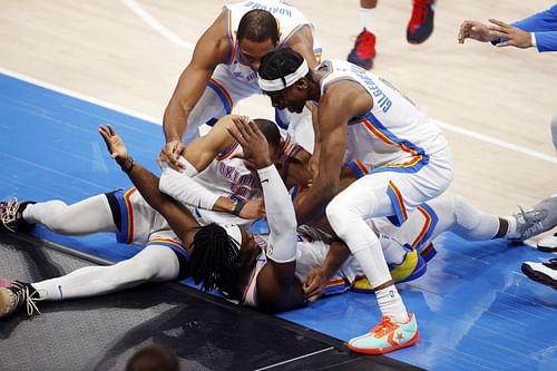 Oklahoma City Thunder players celebrate a game-winner by Luguentz Dort