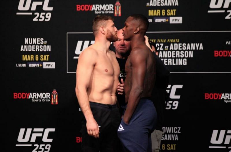 Jan Blachowicz and Israel Adesanya facing off before their fight at UFC 259.