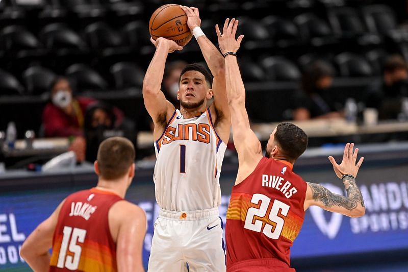 The Phoenix Suns' Devin Booker #1 shoots and scores