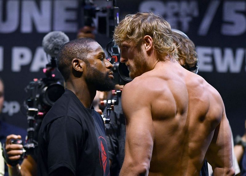 Floyd Mayweather (left) and Logan Paul face off.