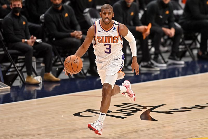 Chris Paul #3 dribbles against the Denver Nuggets.