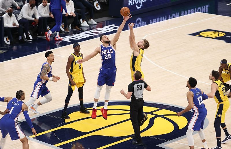 Ben Simmons of the Philadelphia 76ers vies with Domantas Sabonis of the Indiana Pacers