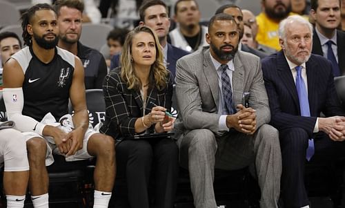 Assistant coaches Becky Hammon, Ime Udoka, and head coach Gregg Popovich