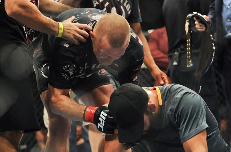 Georges St-Pierre consoles Johny Hendricks after UFC 167