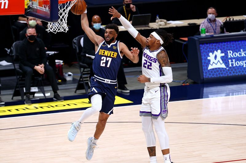 Richaun Holmes #22 of the Sacramento Kings (right) in action