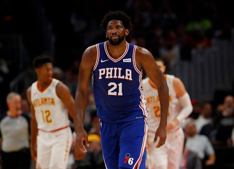 Joel Embiid #21 reacts after hitting a three-point basket