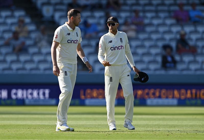 Ollie Robinson (left) and Joe Root.